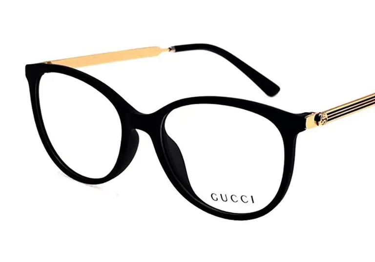 a pair of glasses with a gold metal frame and a black and gold frame