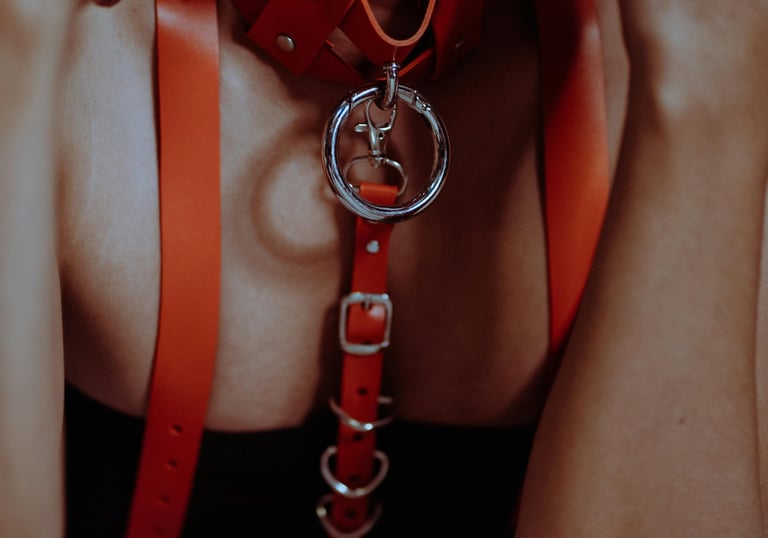 A subservient woman with a red collar bending over