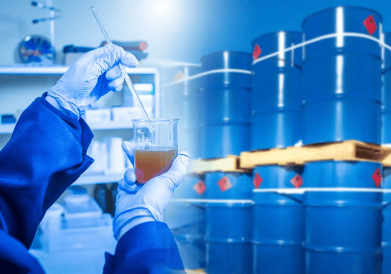 a man in a blue jacket and gloves holding a beaker