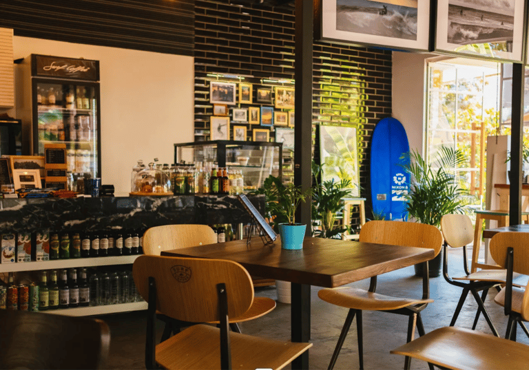 a surfboarder sitting in a restaurant
