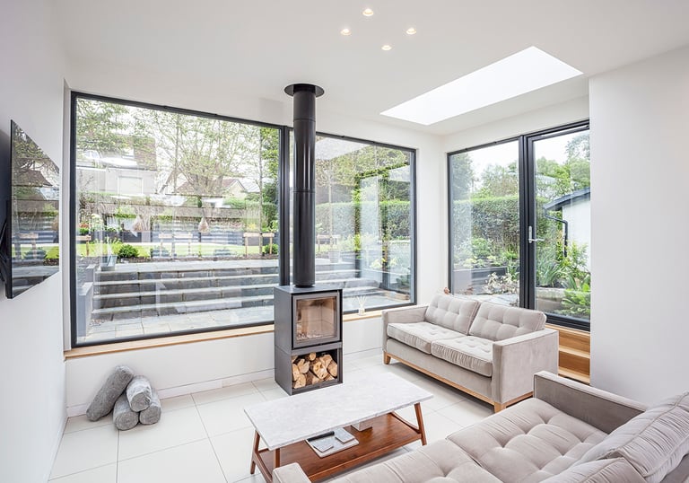 a living room with a fireplace and a fireplace