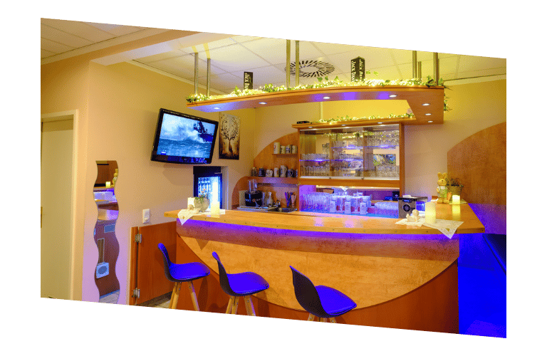 a hotelbar with a bar stool and a television