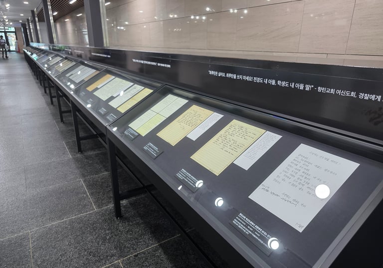 Museum display cases with personal written items