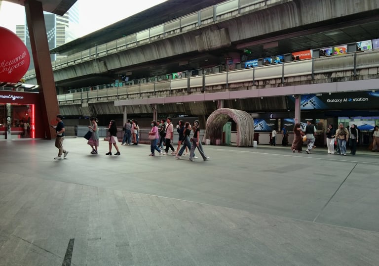 a group of people walking around a city