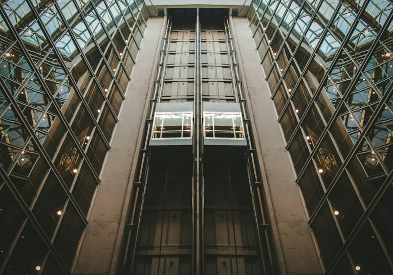 Multiple passenger elevators in commercial building for maintenance services by Stellify Elevators