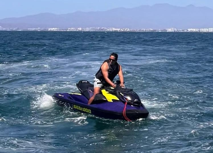 a man riding a jet ski in the ocean