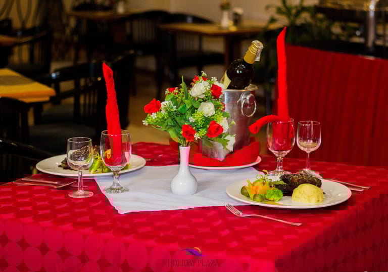a table with a wine bottle and wine glasses