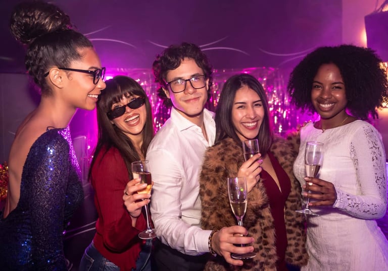 Group enjoying drinks together during a Las Vegas strip club crawl nightlife experience