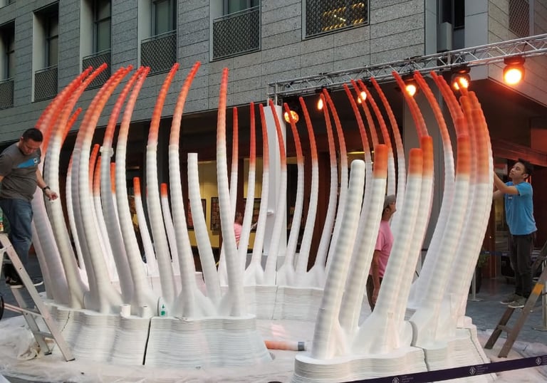 Workers installing a large 3D printed Mansoon Concept at DIFC, Dubai, UAE 
