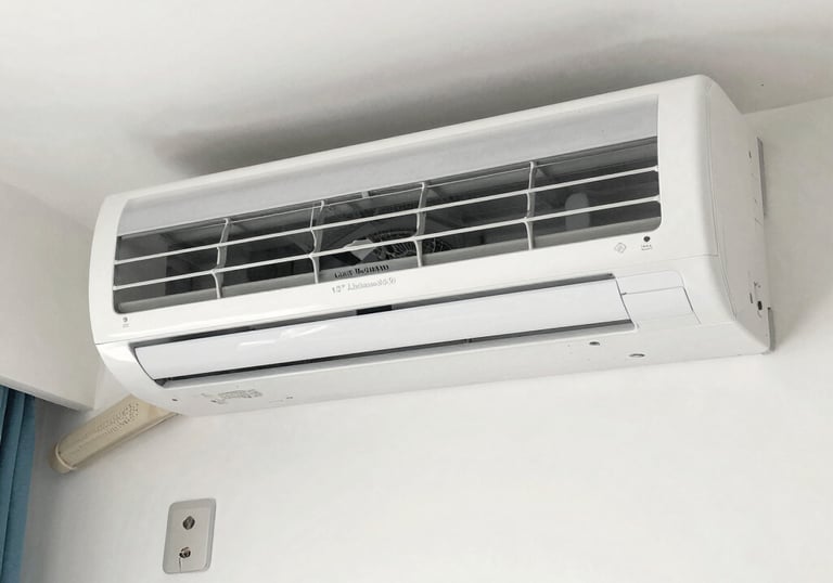 Close-up of a technician performing maintenance on an air conditioning unit.