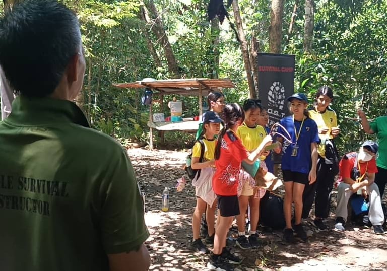 Students and volunteers participating in a forest conservation volunteering program in Borneo