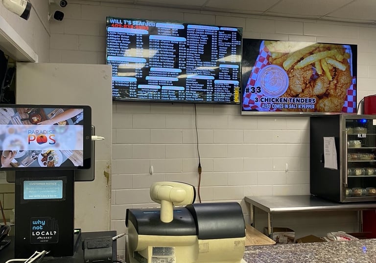 A Tv menu and display inside a restaurant