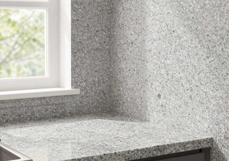 Spray granite finish on kitchen worktop and splashback wall