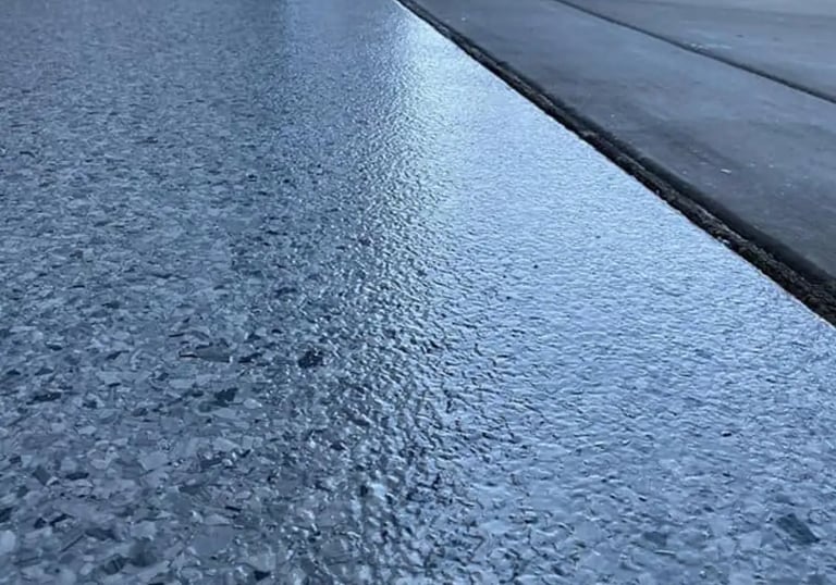 Flake system resin floor with top coat in Garage