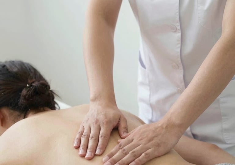 A serene spa room with soft beige and gold accents, featuring a massage table ready for lymphatic drainage.