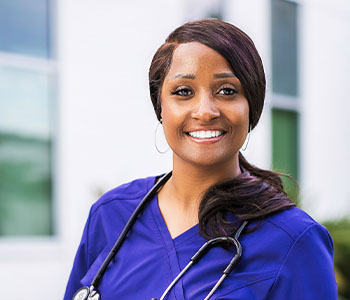 a woman in a blue scrubsuit and a stethoscoped steth