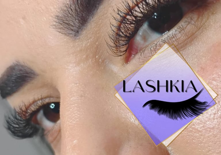 Close-up of a woman's eyes with professional volume eyelash extensions and defined eyebrows.