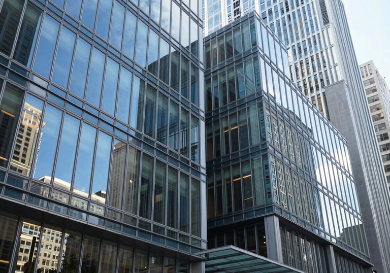 An architectural photography shot of a modern glass-walled corporate lobby in a major US city, clean lines, with Sky Blue reflections on the windows.