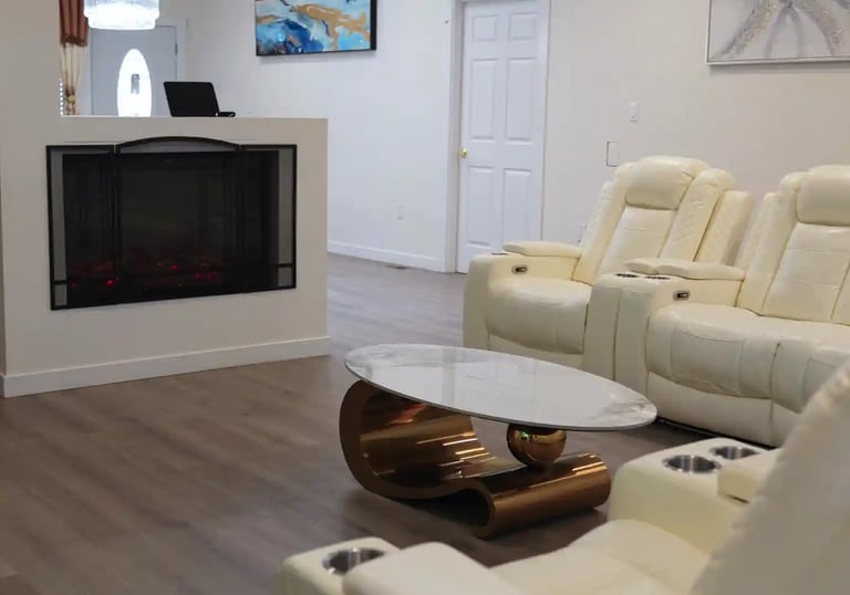 Bright living room in adult family home with comfortable seating and open space for residents.