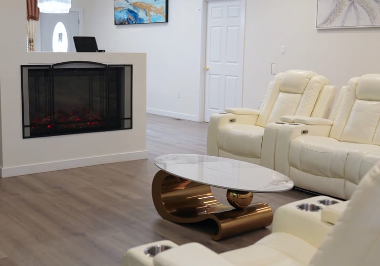 Bright living room in adult family home with comfortable seating and open space for residents.