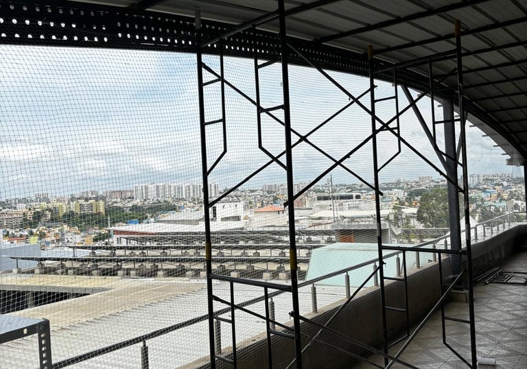 Close-up of a safety net being inspected for wear and tear on a balcony.Close-up of a safety net bei