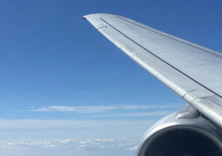 a man riding a skateboard down a street next to tall buildings
