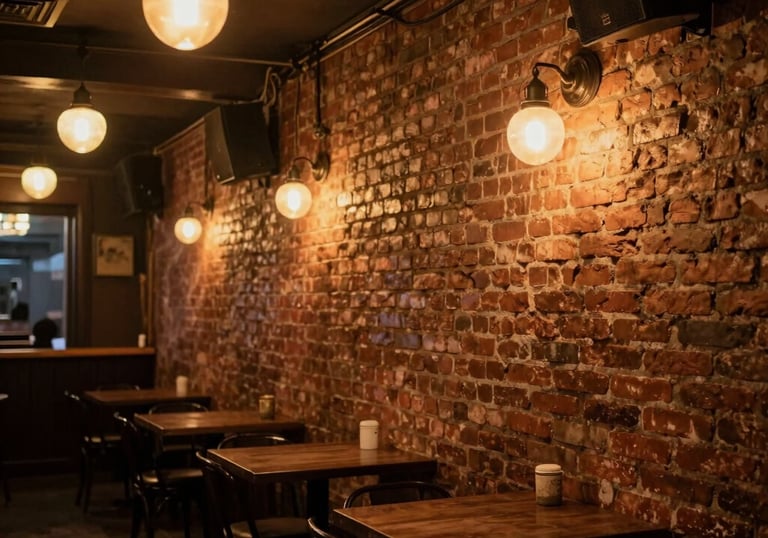 An atmospheric interior view of a brick-walled music venue in Buenos Aires inspired by the classic British clubs, featuring warm amber lighting and a nostalgic Argentine cultural vibe.