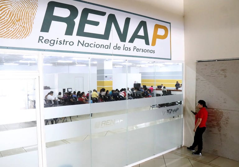 RENAP office entrance showing citizens waiting inside for official registration and identity services.