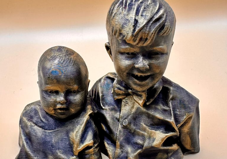 A 3D printed bronze bust sculpture of two young brothers with detailed textured layers and metallic finish.