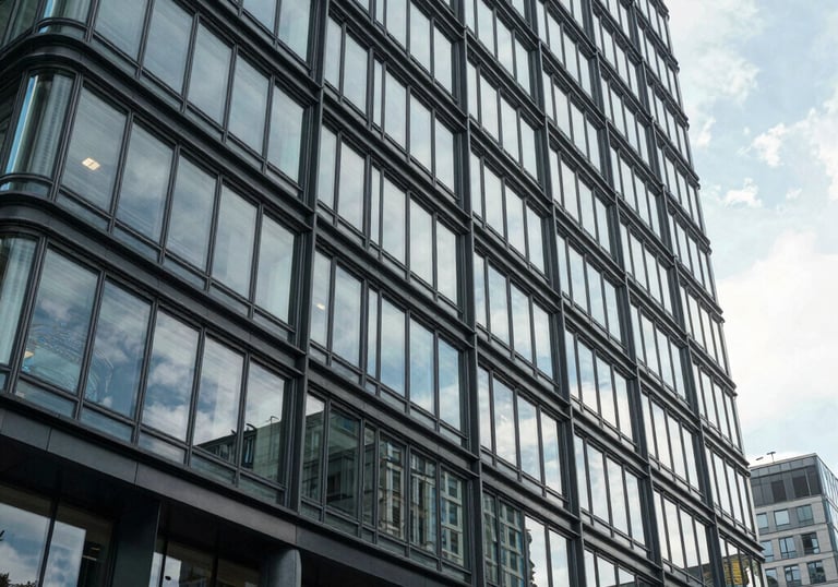 An exterior view of a modern glass and steel commercial building in a Central European business district, symbolizing growth and professional reach.