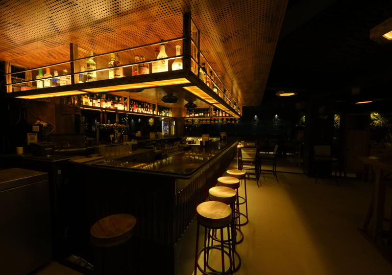 Interior of Filament Cocktail Bar Baner featuring modern bar design and ambient lighting.