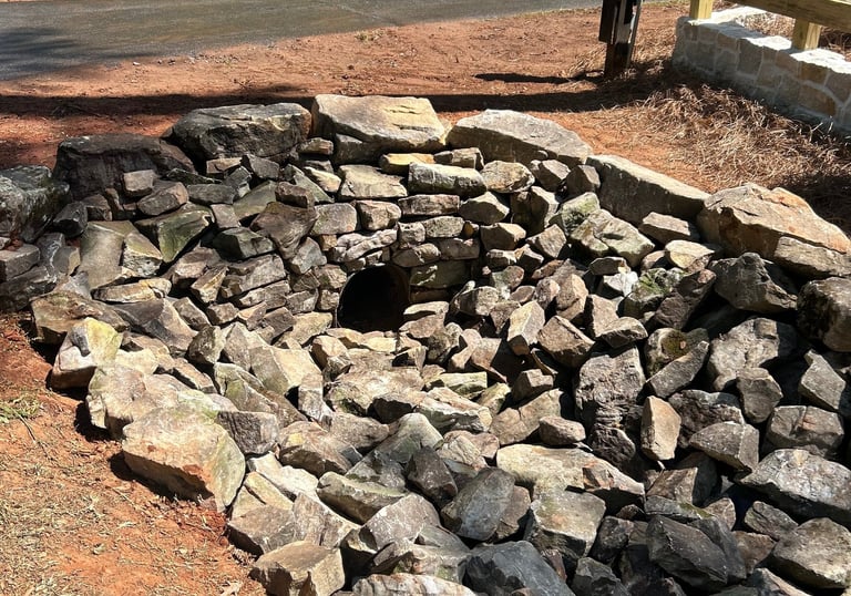 Culvert pipe stacked stone headwall