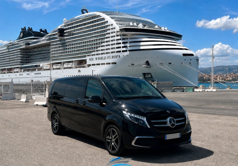 Black Mercedes V-Class luxury minivan parked by the MSC World Europa cruise ship in Marseille port.