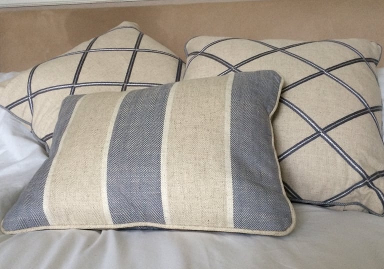 Bespoke piped cushions in blue and beige fabrics that tone beautifully