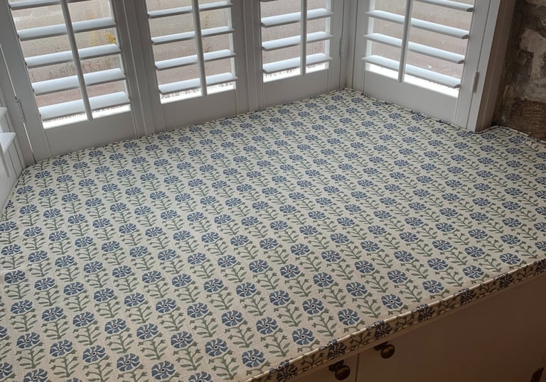 A bespoke window seat cushion shaped to fit an awkward space.