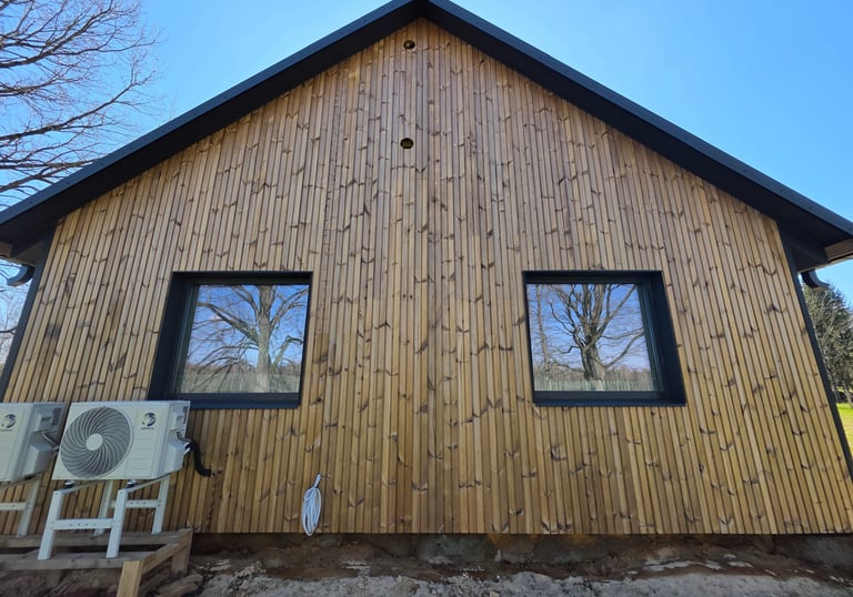 a house with a wooden siding and a window