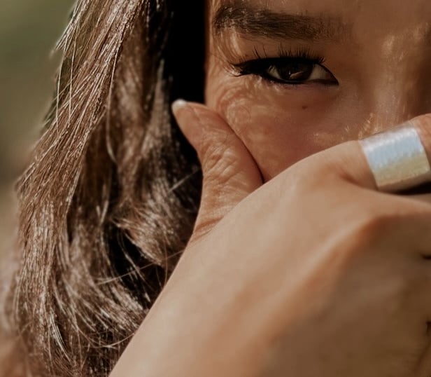 a woman with a ring on her finger