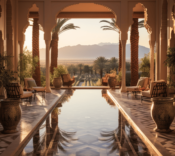 Long reflective pool with deep blue water and natural stone tiling set in a Moroccan-inspired courty