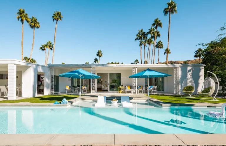 Minimalist rectangular pool with pale aqua water and light interior finish, clean modern design