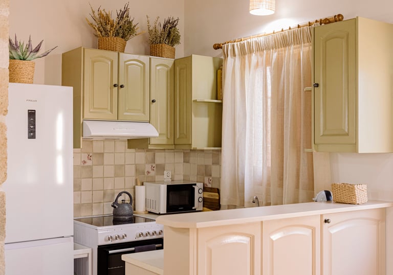 A kitchen with a refrigerator, microwave, and oven | Tonia's Cottage