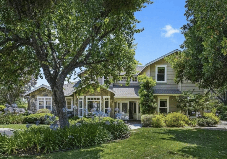 a house with a large yard and trees