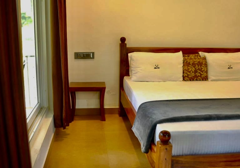 NELLIYAMPATHY STAY AT WOODSVLLE BEDROOM