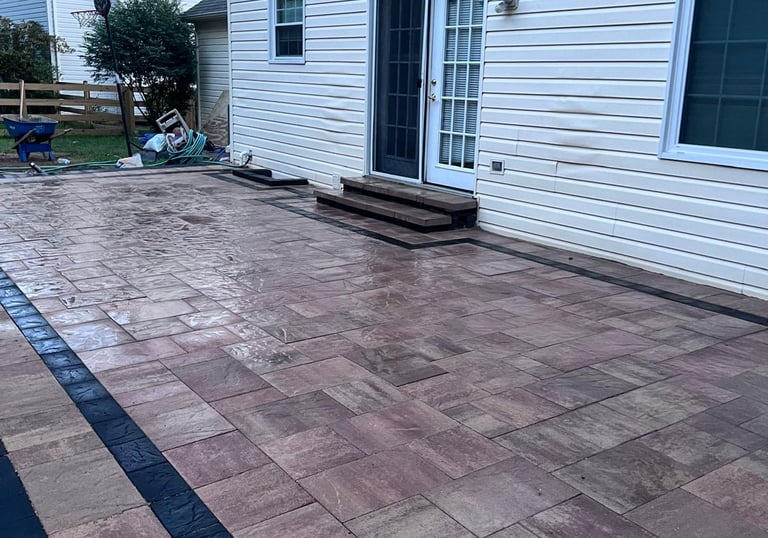 a patio with a brick patio with a brick patio