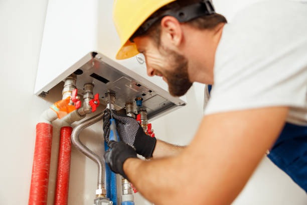 plumber installing a water heater 