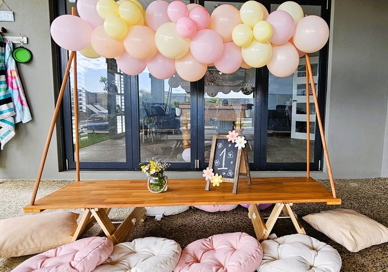 teepee picnic table hire daisy bloom with balloon garland