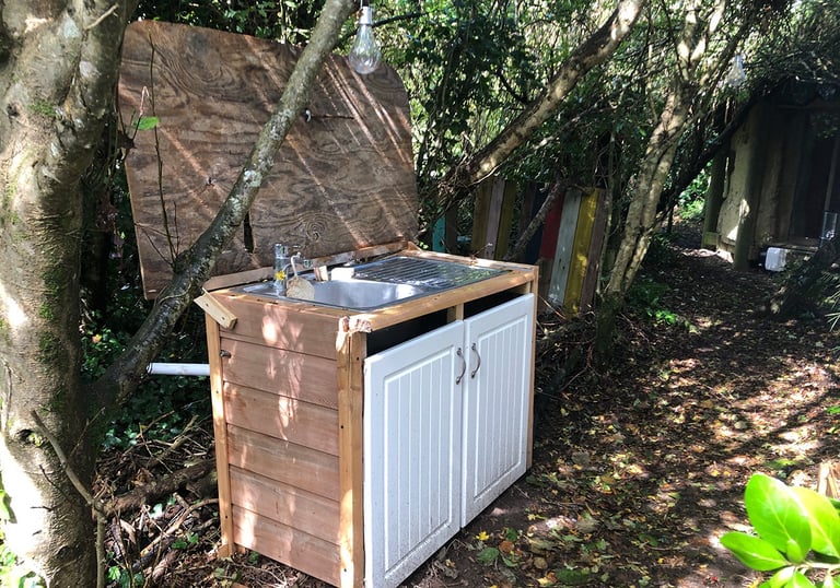 outdoor kitchen sink set in woodland