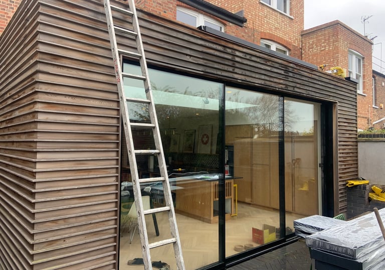 Bespoke cedar wood cladding on a stunning extension specified by the client.