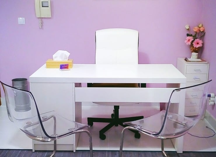 a desk with a chair and a desk with a chair
