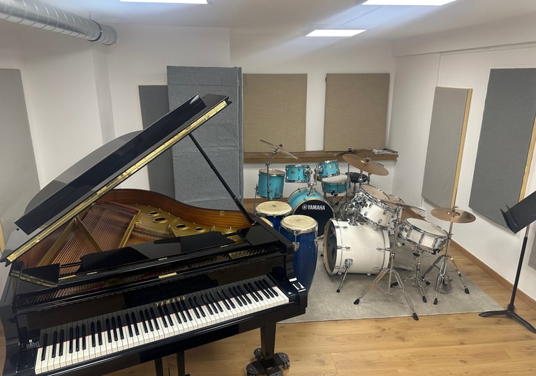 a piano and drums in a room with a latin percussion