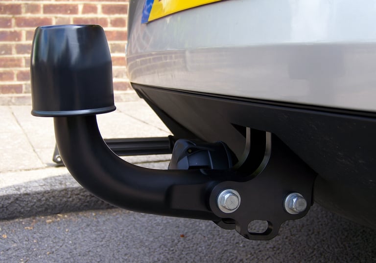 Close-up of towbar installation on a vehicle for enhanced towing capability and safety.